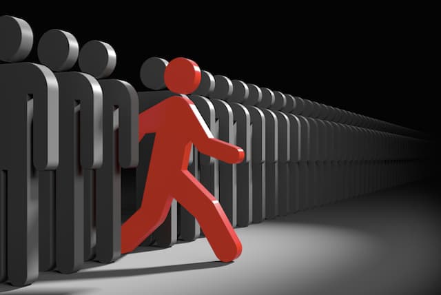 Person Icon stepping out of a line and taking the risk of embracing their individuality.